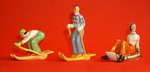 Figurines of females skiing and sledging (Sold)