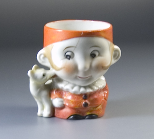 1940s/50s Egg Cup formed as a boy with dog licking hs face
